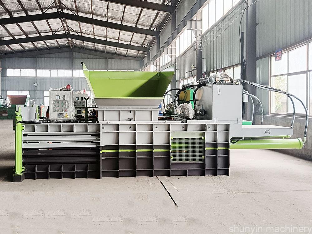 Automatic horizontal baler for seamless, hands-free waste management.  