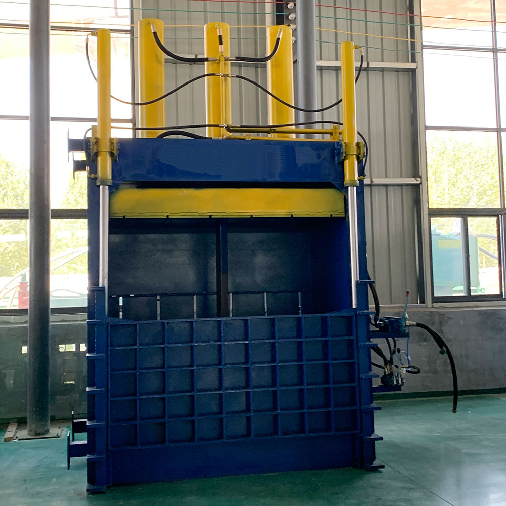 High-capacity vertical baler designed for heavy-duty waste processing.  