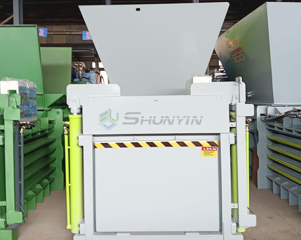 horizontal baler dual-hand control safety system