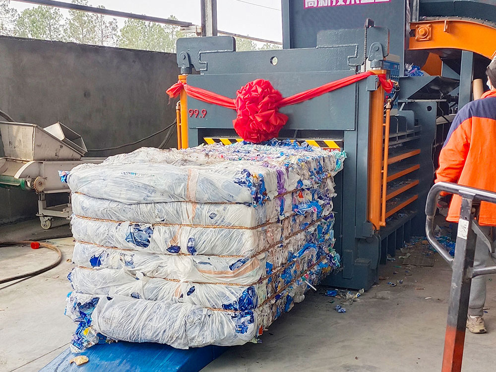 technician programming horizontal baler control interface